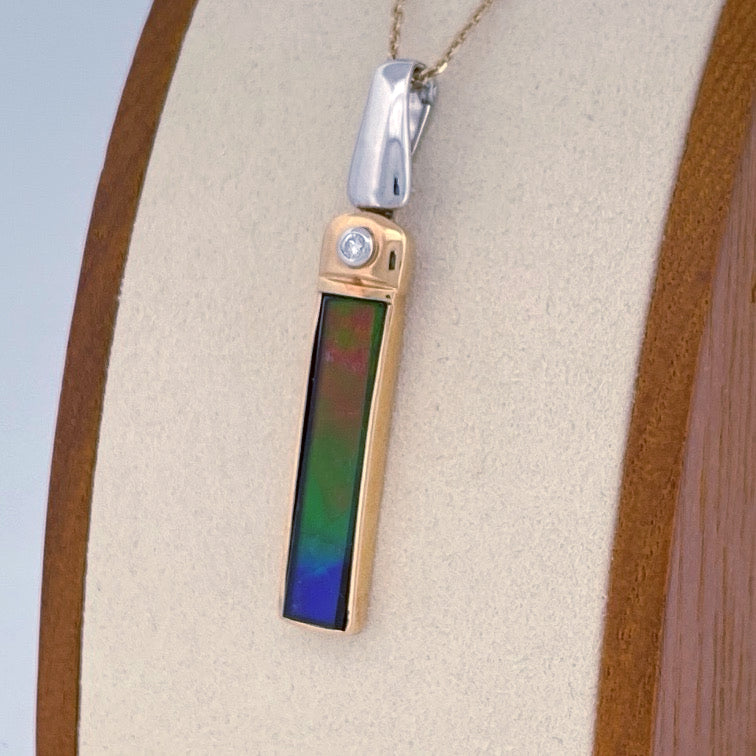 Unveiling a Gemstone Wonder: 18k Two-Tone Ammolite & Diamond Pendant (On Consignment)