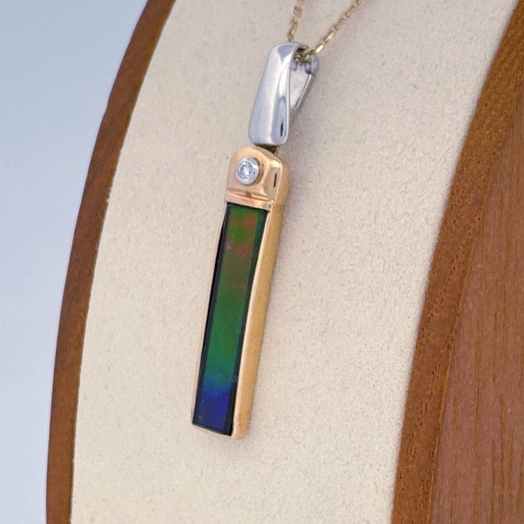 Unveiling a Gemstone Wonder: 18k Two-Tone Ammolite & Diamond Pendant (On Consignment)