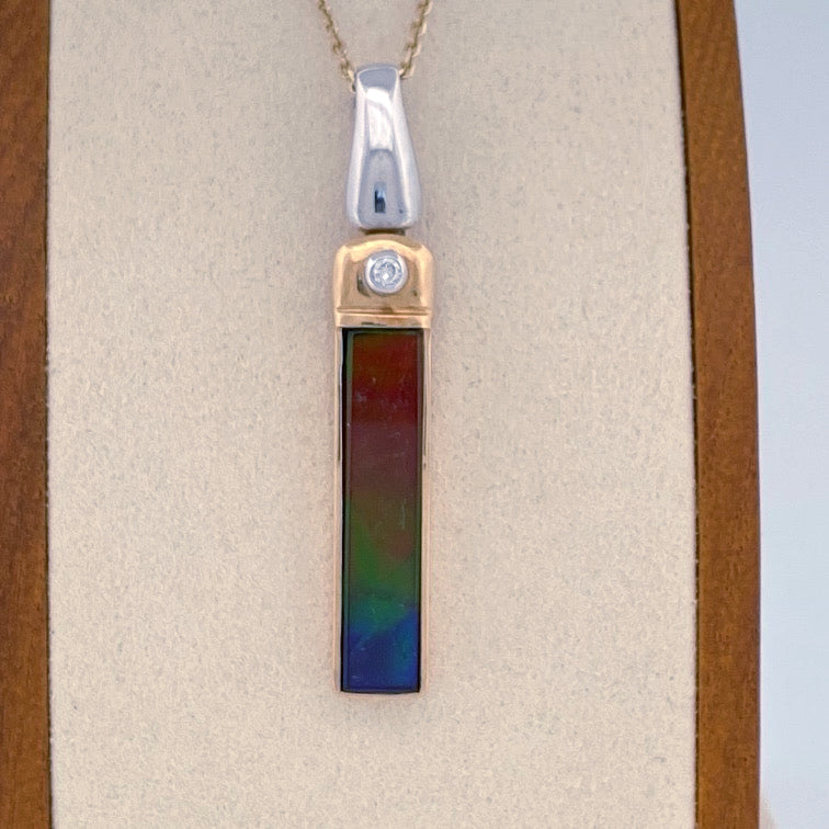 Unveiling a Gemstone Wonder: 18k Two-Tone Ammolite & Diamond Pendant (On Consignment)