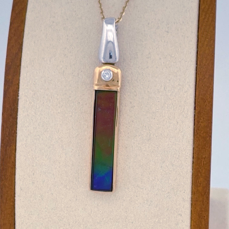 Unveiling a Gemstone Wonder: 18k Two-Tone Ammolite & Diamond Pendant (On Consignment)